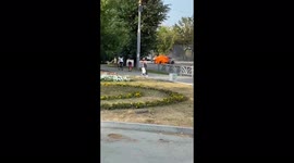 Burning taxi rolls down street in west Russian city