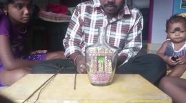 Miniature artist from eastern India creates idol of Hindu God inside bottle