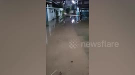 Floodwaters cover roads and enter riverside homes in Pathum Thani, Thailand