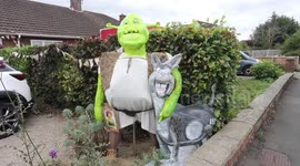Thousands flock to UK village as homeowners decorate homes with wacky scarecrows