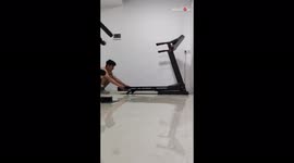Gym rat does an impressive forward roll on running treadmill