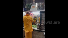 Man doing prayers at the small temple in Mumbai, India during Ganesh Chaturthi festival