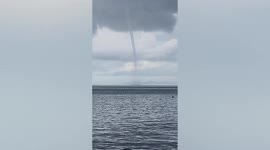 Large waterspout stuns tourists enjoying holiday on Thai beach