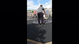 ''Round, round & OUT!' Girl stands up at the wrong time & falls off a spinning merry-go-round 
'