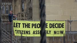 Extinction Rebellion activist scales scaffolding within Houses of Parliament in latest protest against climate change