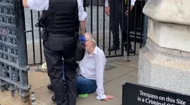 Extinction Rebellion activists stage protest at House of Commons, glueing themselves to ground