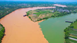 Different coloured rivers meet to make perfect boundary in China