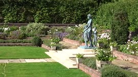 Gardener trimming plants at Princess Diana Memorial Garden at Kensington Palace
