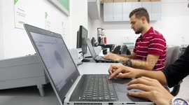 Palestinian engineers work on the prosthetic hand for people with disabilities