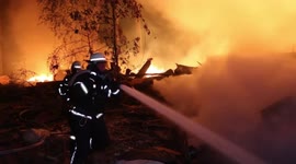Firefighters battle blaze after Russian rocket attack on Kharkiv, Ukraine