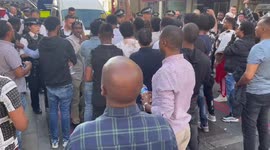Protesters try to break police line to storm a rally in front of Eritrean Embassy in London