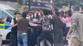 Clashes with police as protesters try to storm their way to the Eritrean Embassy in London