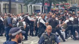 Dozens of police disperse and arrest protesters blocking major north London road near Eritrean Embassy