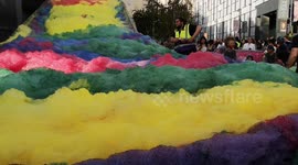 Children enjoy huge rainbow foam show in London's Greenwich Peninsula