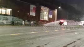 Police chase protesters after objects thrown during rally in Santiago, Chile