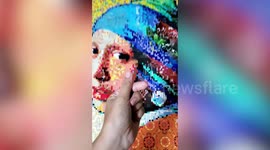 Artist creates amazing 'Girl with a Pearl Earring' mosaic from recycled trash in the Philippines