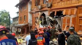Firefighters rescue woman from collapsed house after earthquake strikes China
