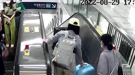 Suitcase knocks woman over after falling down escalator in eastern China