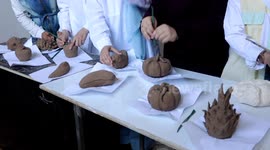 Palestinian youths participate in a class to learn make clay sculptures, in Khan Younis, in the southern of Gaza strip