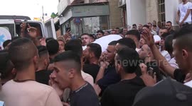 Mourners attend the funeral of Palestinian Taher Mohamed Zakarneh, who was killed during clashes with Israeli soldiers
