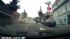 Motorists terrified as earthquake shakes road and collapses buildings in China