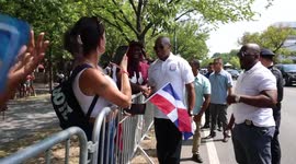 New York City Mayor Eric Adams greets revelers at West Indian Day Parade