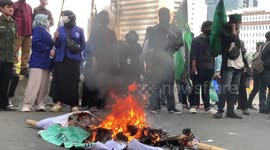 Indonesian students burn tires during protest against fuel price hike