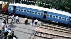 Man abandons motorcycle on track seeing fast-approaching train hits in India
