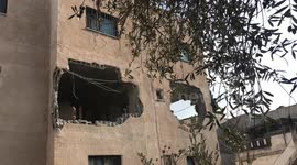 Palestinians inspect the house of Raed Hazem after it was demolished by Israeli forces