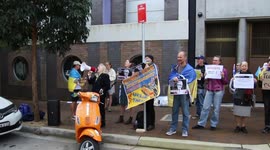 Ukrainians continue protest activity at Amnesty International following release of report, which blames them, Sydney, Australia