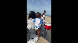 'Curious & fearless toddler almost gets his face shoved into beach sand'
