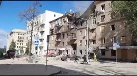 Debris from building strewn across road after Kharkiv targeted by missiles