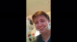 Cat carefully takes glasses off owner's face