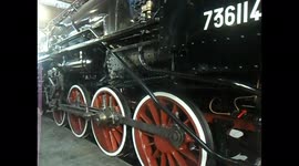 A large black locomotive, in a museum in Naples