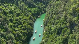 Drone Footage Of Tourists Boating At The Nandan Xiaoqikong Scenic Spot in Hechi City, China