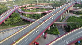 Drome Footage Of Complex Overpass Covered In Flowers in Nanning, China