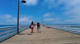 Walking across the San Clemente Pier on a nice day