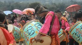 carried away by the atmosphere of the percussion game the player in a trance is unconscious