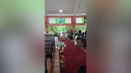Grumpy flower girl throws tantrum dumping basket of petals on wedding aisle