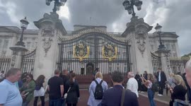 Crowds outside Buckingham Palace anxiously await news on Queen's health