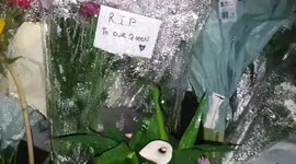 Floral tributes continue to be laid outside Buckingham Palace as mourners undeterred by the heavy rain