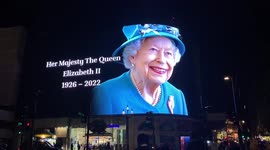 Portrait of Queen Elizabeth II posted on billboard screen in London