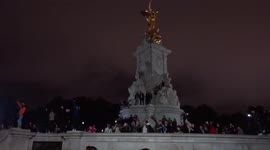 Mourners singing God Save The Queen outside Buckingham Palace