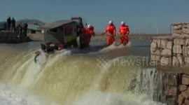 Firefighters rescue rickshaw passengers trapped in rushing river in China’s Hebei