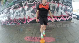 Man shows off freestyle football skills with leftover Halloween pumpkin