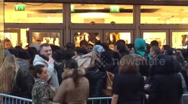 Large crowds form at H&M X Balmain collection release in France