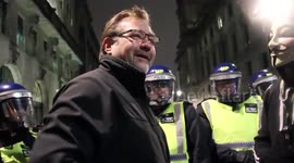 Aggressive spectator antagonises protesters with 'racist' abuse