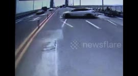 Car crashes into truck after spinning on bridge