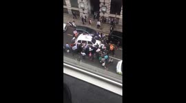 People lift Taxi off women in London