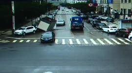 Mobile transformer house hits on parking car after falling off truck